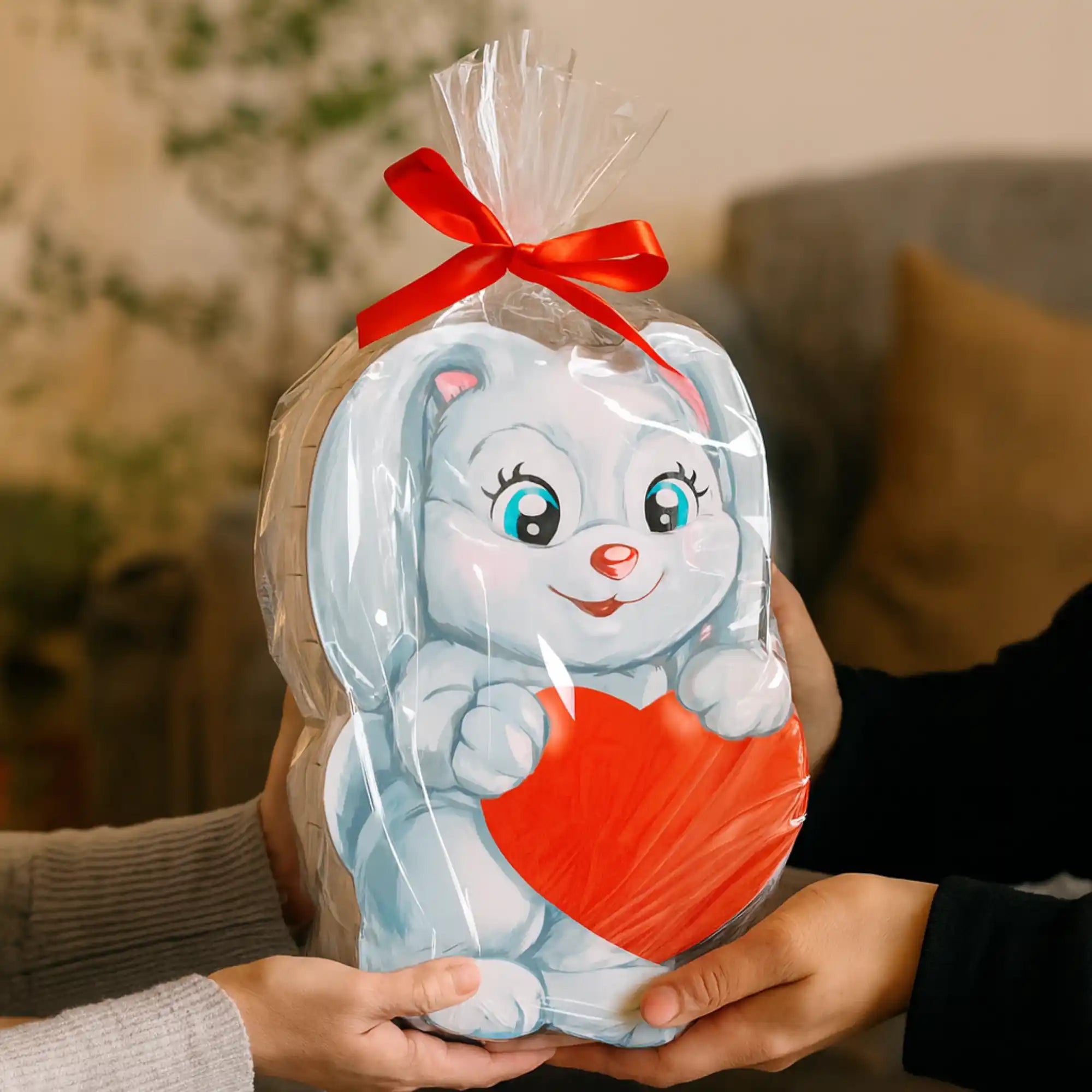 Hasen-Geschenkbox mit Herzmotiv und roter Schleife – festlich verpackte Überraschung für Geburtstag, Valentinstag oder Ostern.